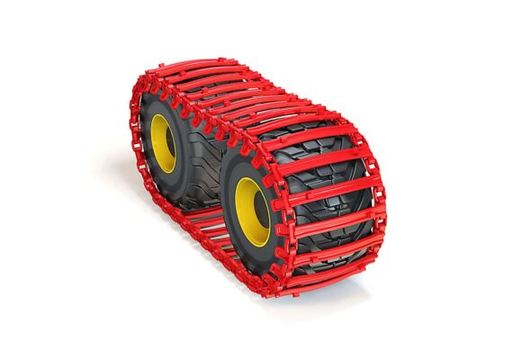 Snežné reťaze Superstud 130 – hustá sieť namontovaná na kolese ťažkého stroja